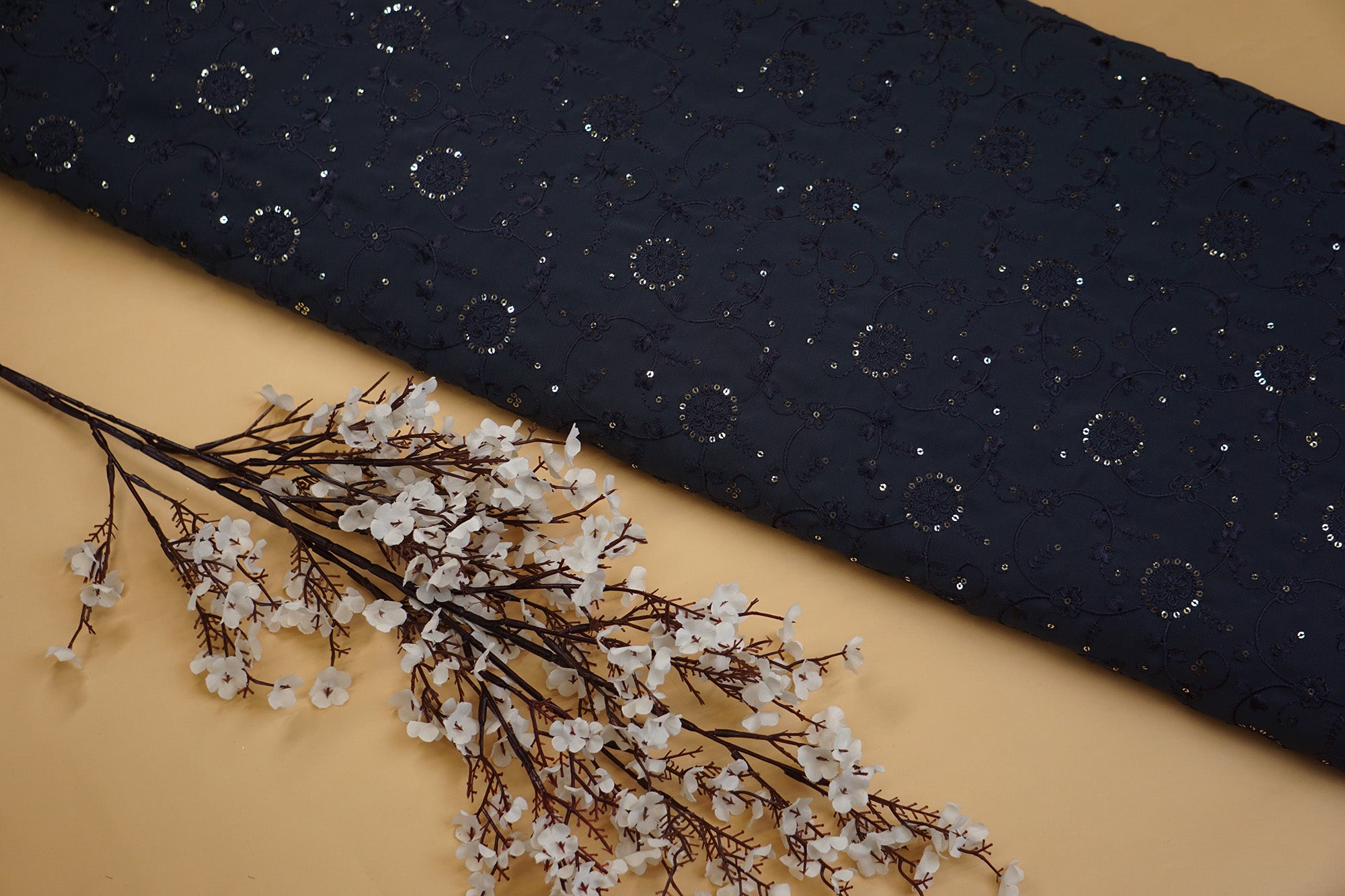 Dark Grey Georgette fabric with thread work with golden sequins creating floral overall pattern- Paras Gallery Fabrics