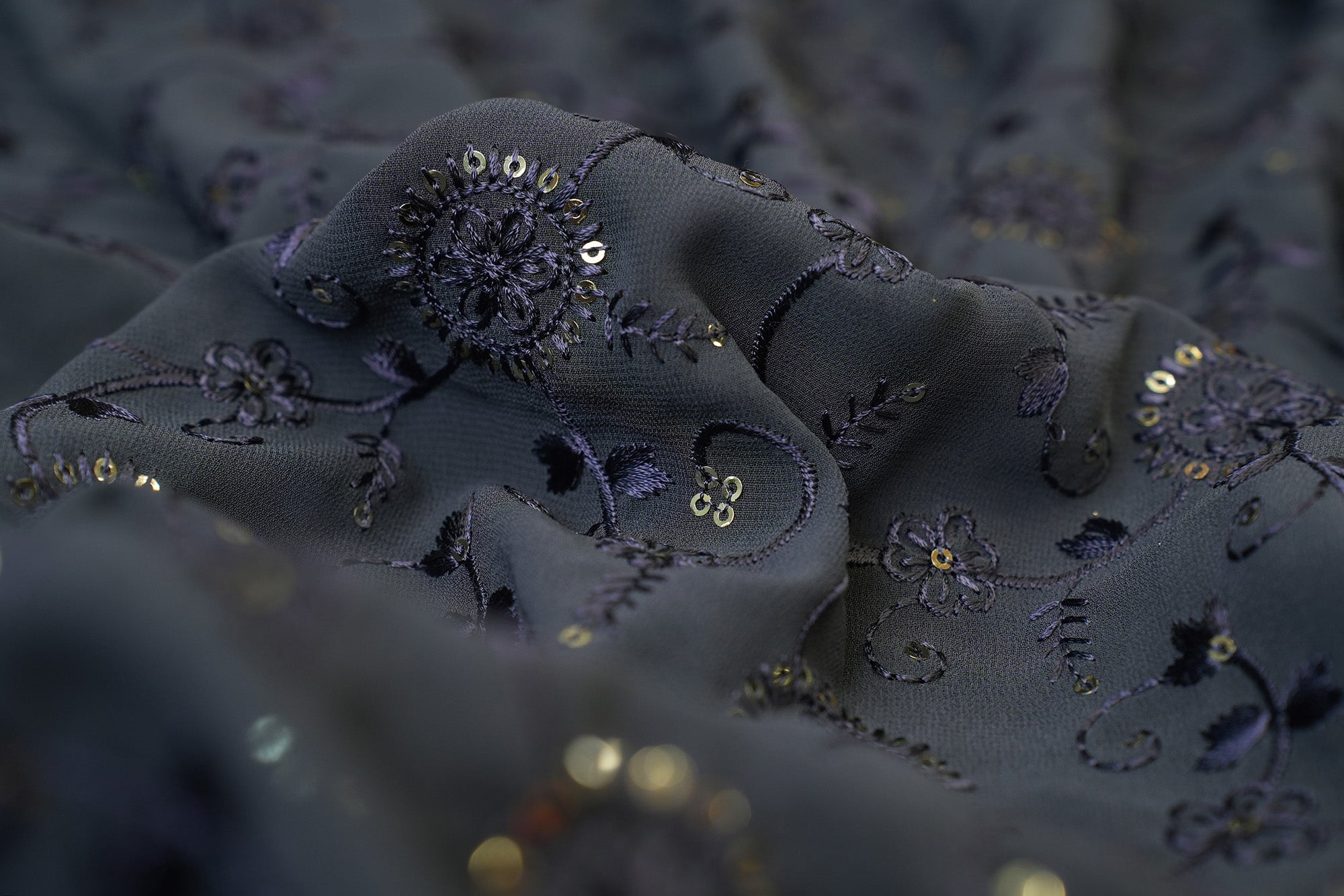 Dark Grey Georgette fabric with thread work with golden sequins creating floral overall pattern