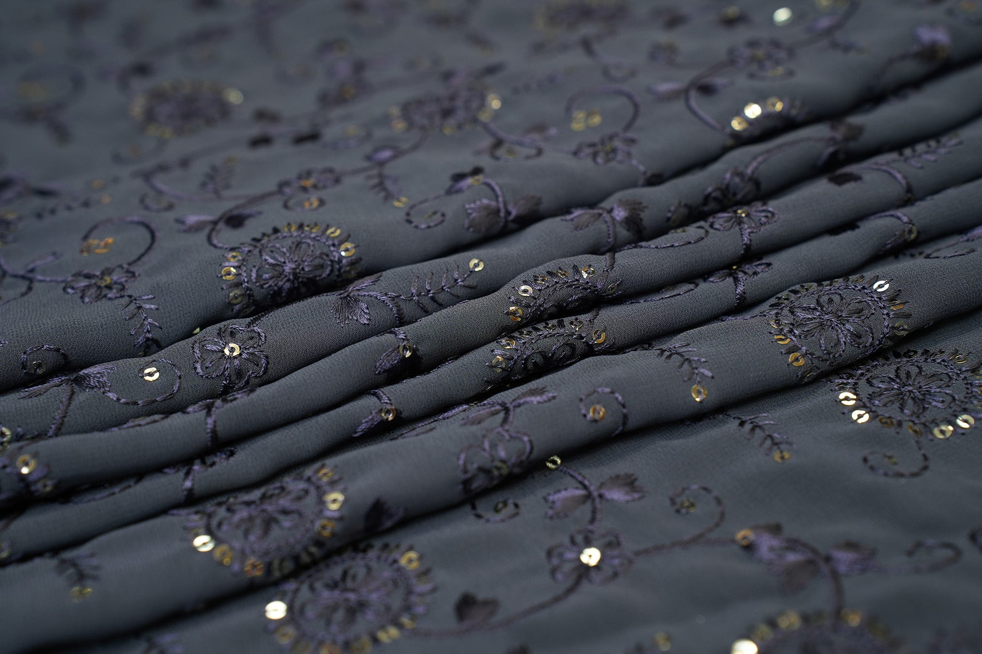 Dark Grey Georgette fabric with thread work with golden sequins creating floral overall pattern