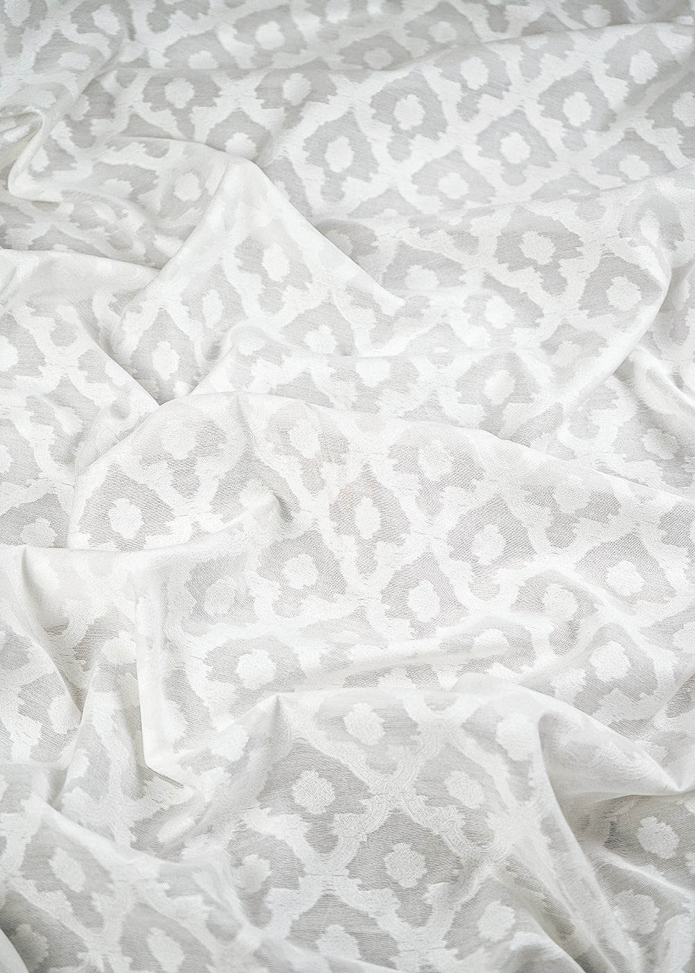 White Dyeable Cotton Fabric With All Over Self Work 10012