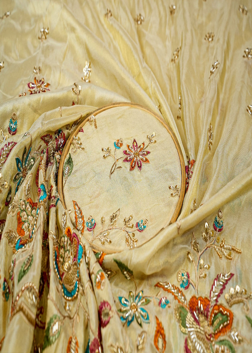 Golden-Tissue-Fabric-with-Heavy-Floral-Border-of-Sequins,-Beads,-Kutdana,-and-Threadwork-11636-close-view