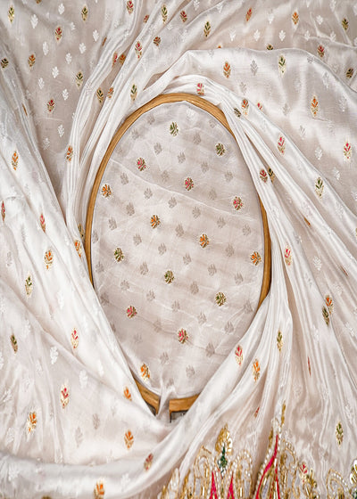 White Silk Fabric With All Over Zari Buti With One Side Zari, Thread and Sequins Work and Scalloped Border 15999