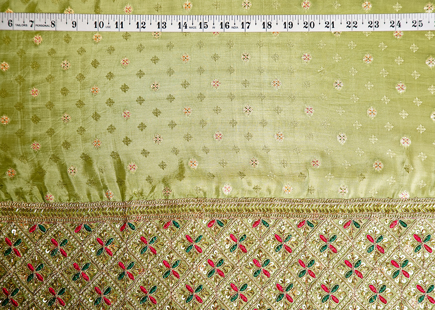 Pista Green Silk Fabric With All Over Zari Buti With One Side Zari, Thread and Sequins Work Border 16002