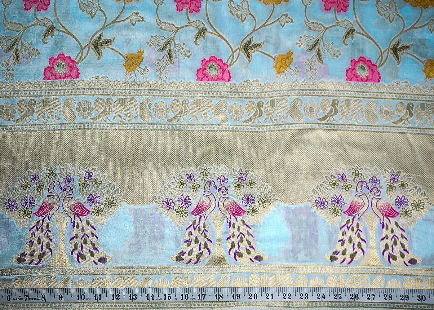 Ice Blue Upada Silk Fabric With All Over Floral Print And Zari Work With One Side Heavy Border 16419