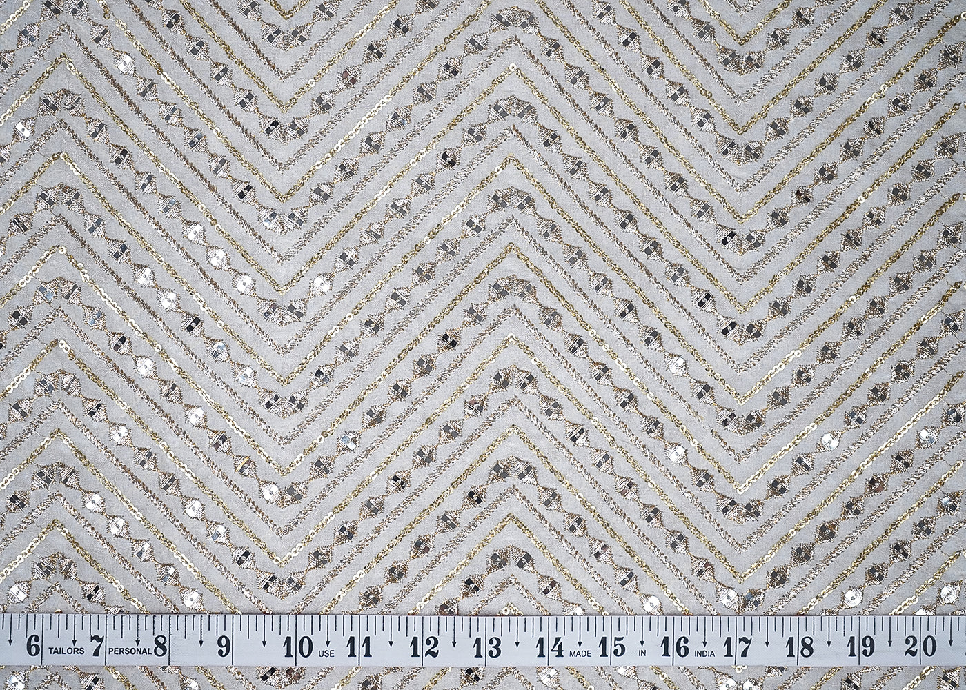 White Georgette Fabric With All Over Zari And Sequins Work With One Side Border 19200
