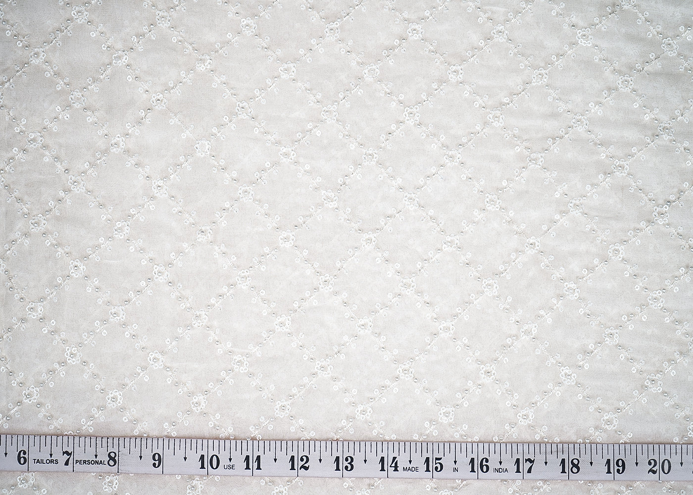 White Georgette Fabric with Allover Jaal Pattern of Sequins, Thread and Pearl Work 19663