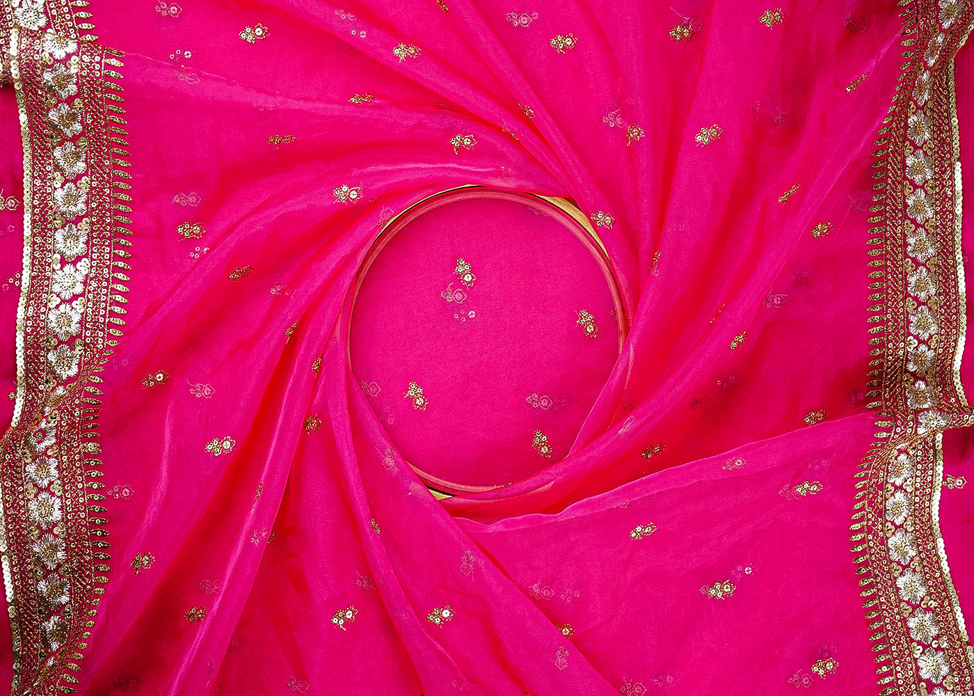 Rani Pink Organza Fabric With All Over Zari And Sequins Buti With Two Side Border 21049