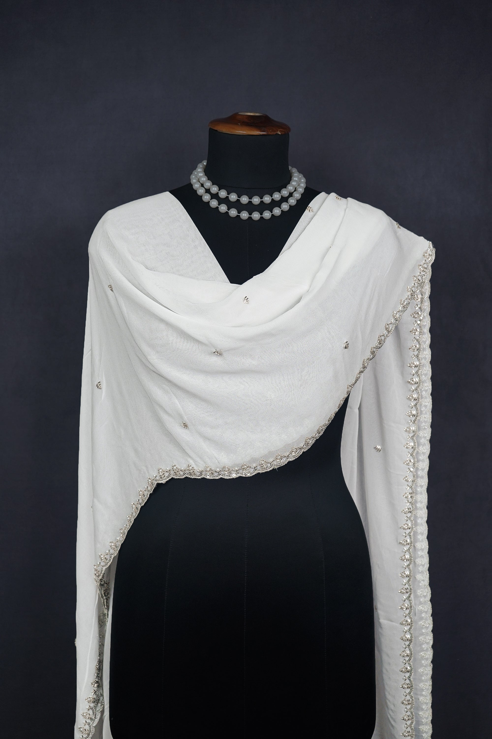 white-georgette-dupatta-with-all-over-katdana-bead-sequins-and-zari-work-with-scalloped-borders-21556-real-view