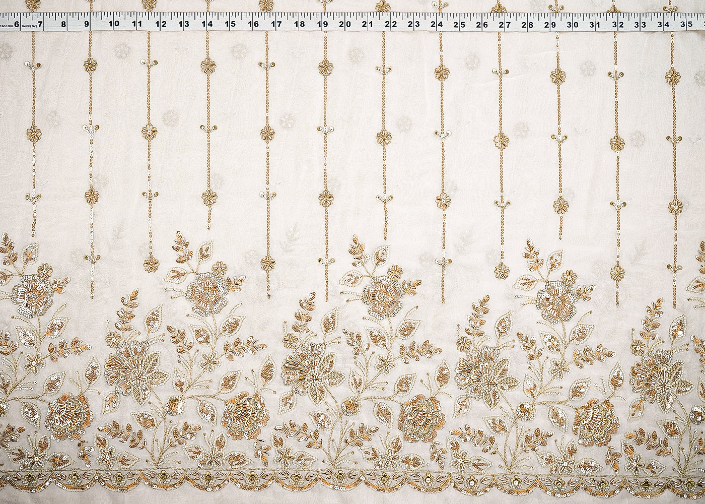 White Dyeable Georgette Fabric With All Over Stripes Of Zari, Sequins, Beads And Katdana With One Side Scalloped Border 21572