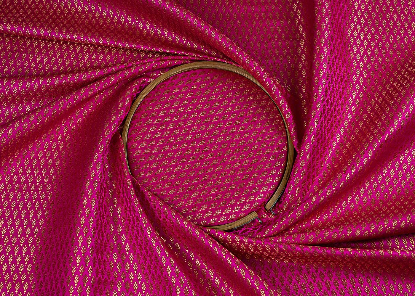 rani-pink-banarasi-brocade-fabric-with-all-over-golden-zari-handloom-23165-close-view