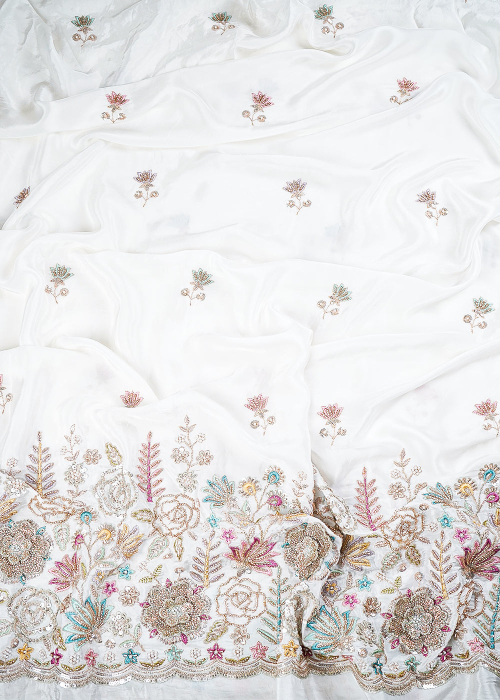 White Dyeable Crepe Fabric With All Over Sequins, Katdana, Zari, Thread, Bead And 3D Work With One Side Heavy Border 23689