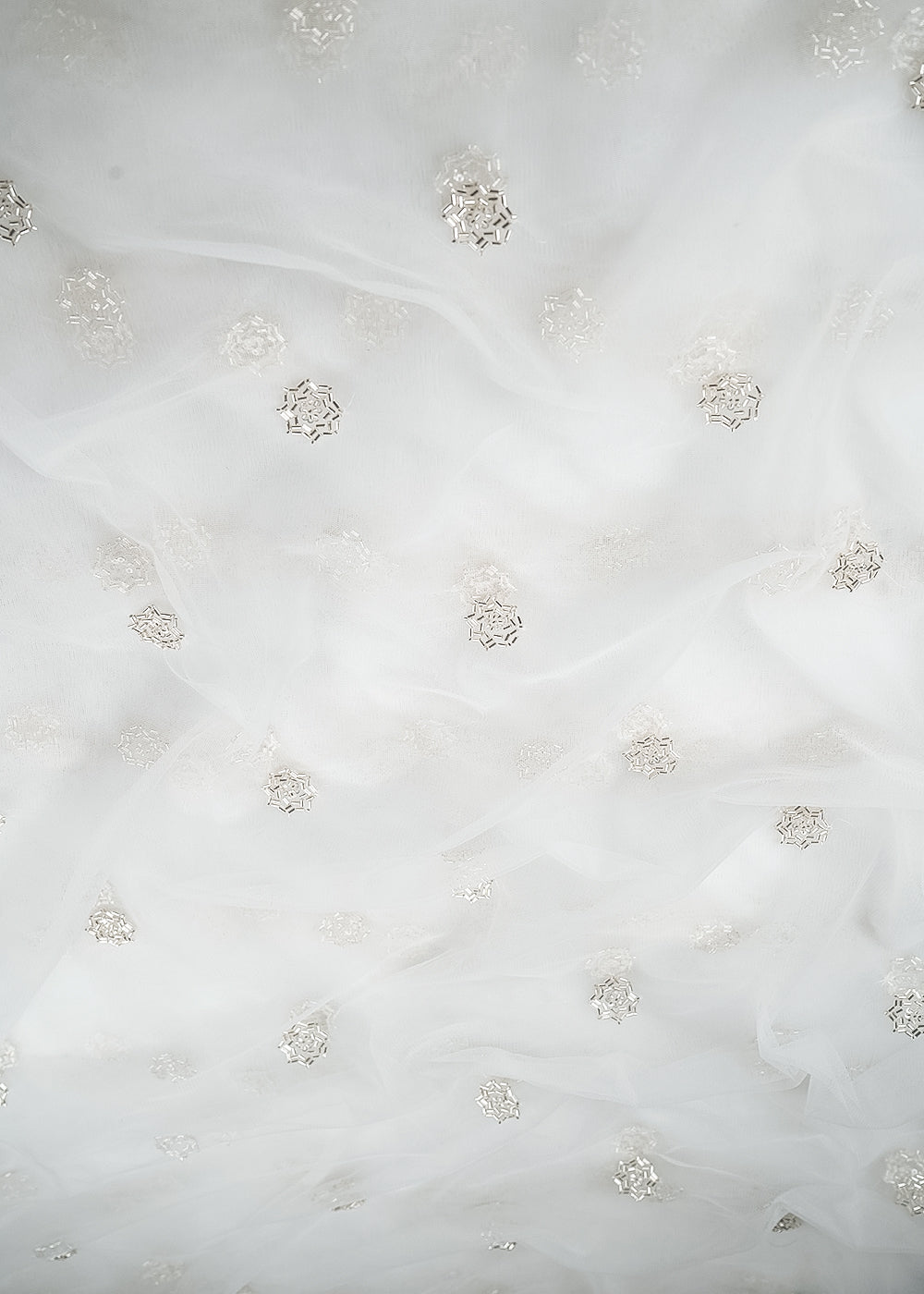 White Dyeable Net Fabric With All Over Buti Of Sequins And Katdana Work 24308