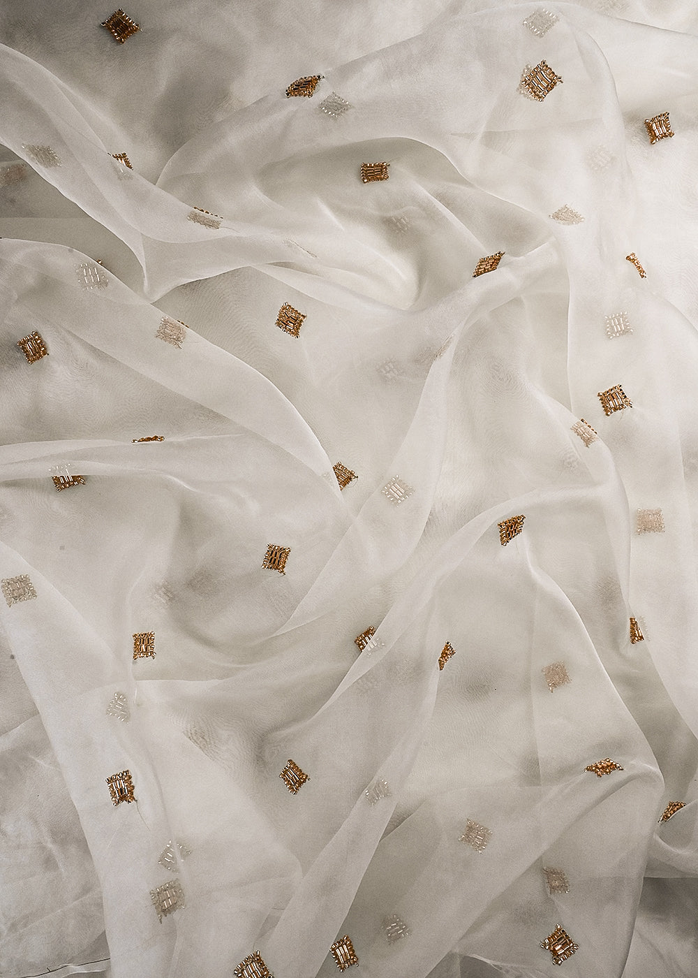 White Dyeable Organza Fabric With All Over Buti Of Katdana Work 25185