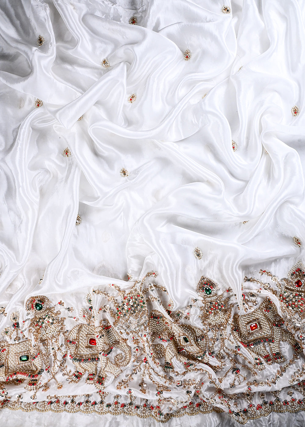White Dyeable Crepe Fabric With All Over Zari, Sequins, Katdana And Stone Work With One Side Heavy Border 25666