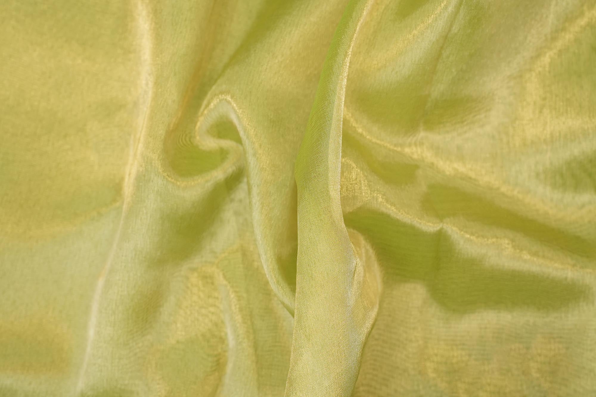 Light parrot green coloured tissue fabric with golden shimmer
