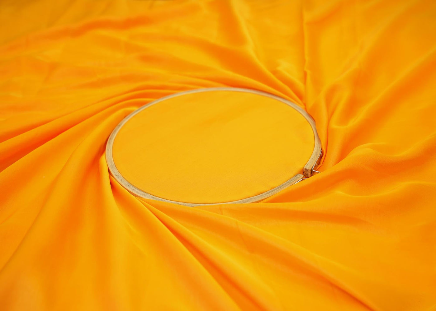 Orange coloured barfi silk fabric