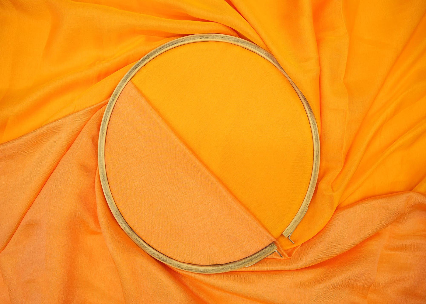 Orange coloured barfi silk fabric
