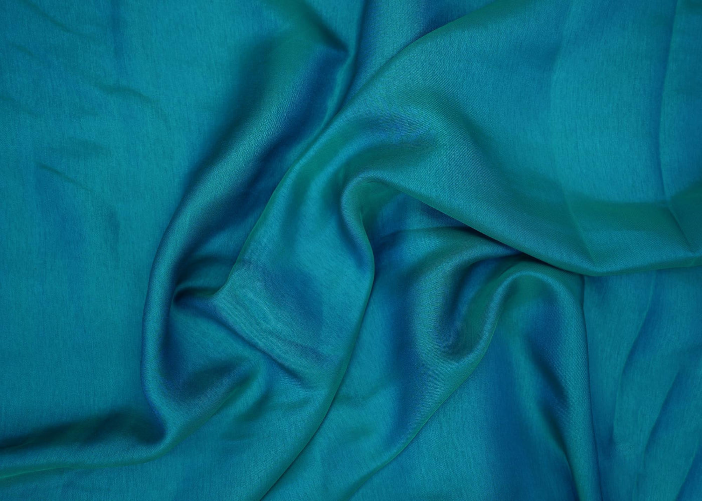 Turquiose coloured barfi silk fabric