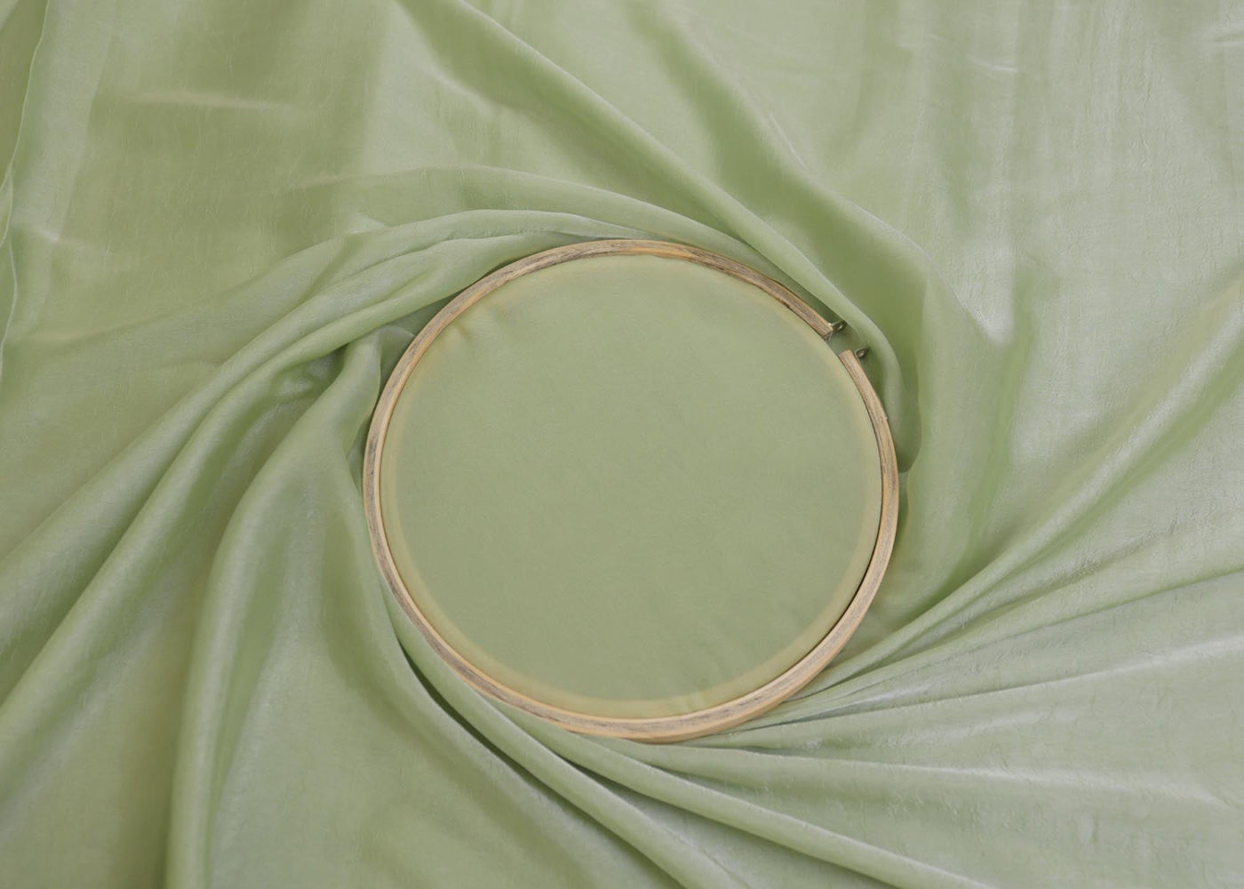 Pista green coloured silk crushed texture fabric - Paras Gallery Fabrics