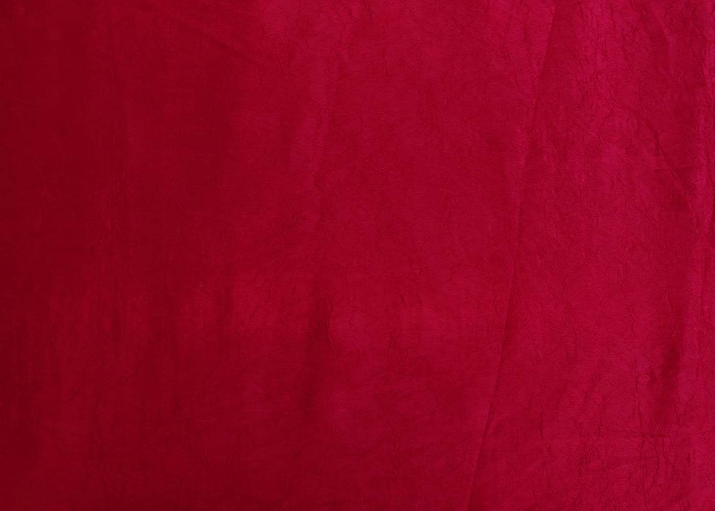 Rani pink coloured silk crushed texture fabric