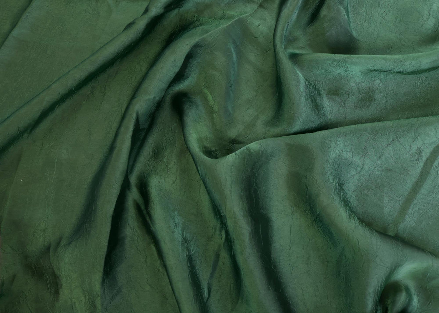 Dark green coloured silk crushed texture fabric
