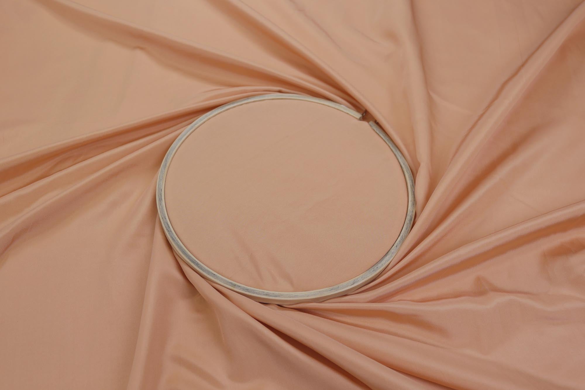 Pastel orange coloured habutai silk fabric