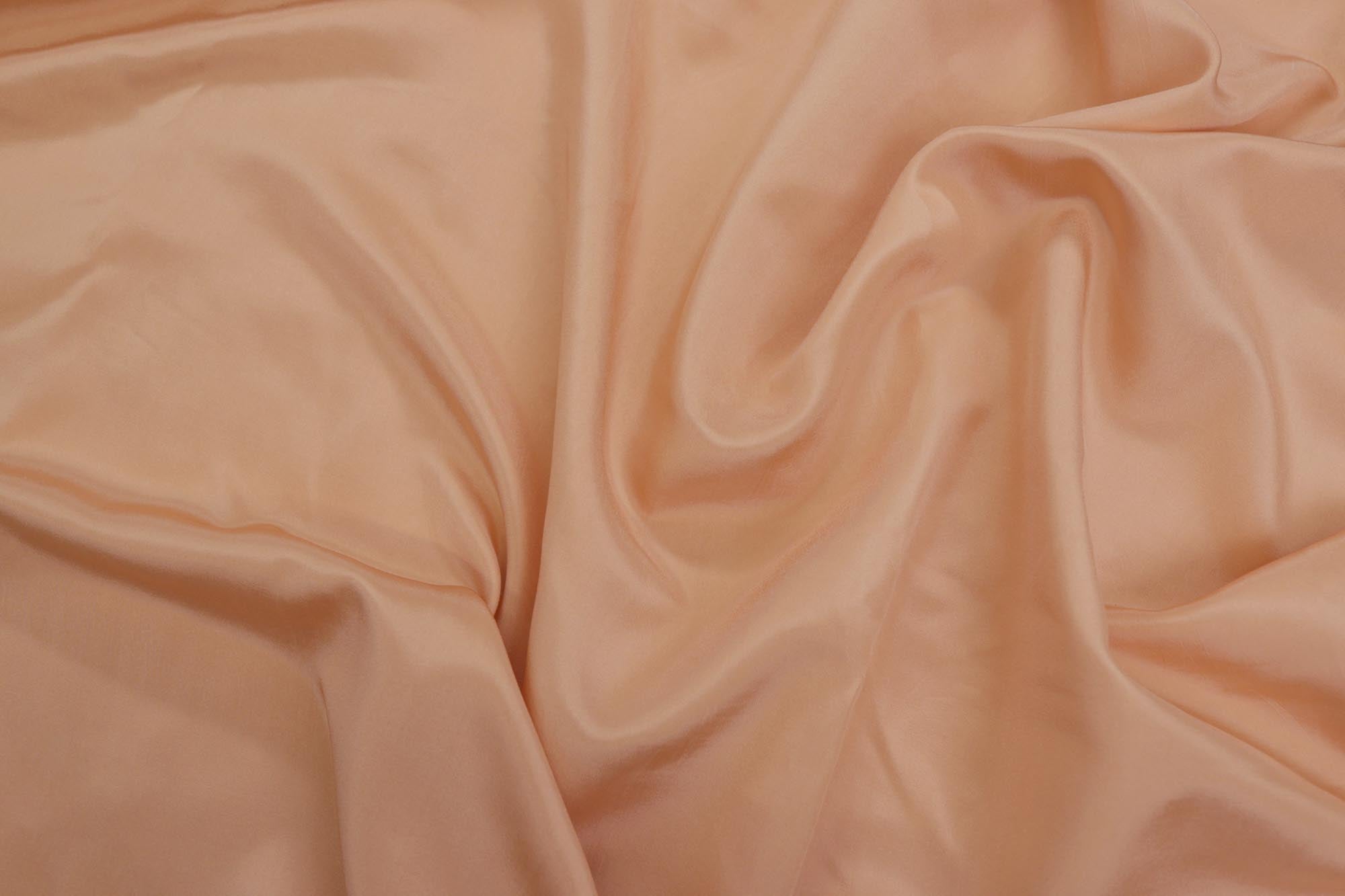 Pastel orange coloured habutai silk fabric