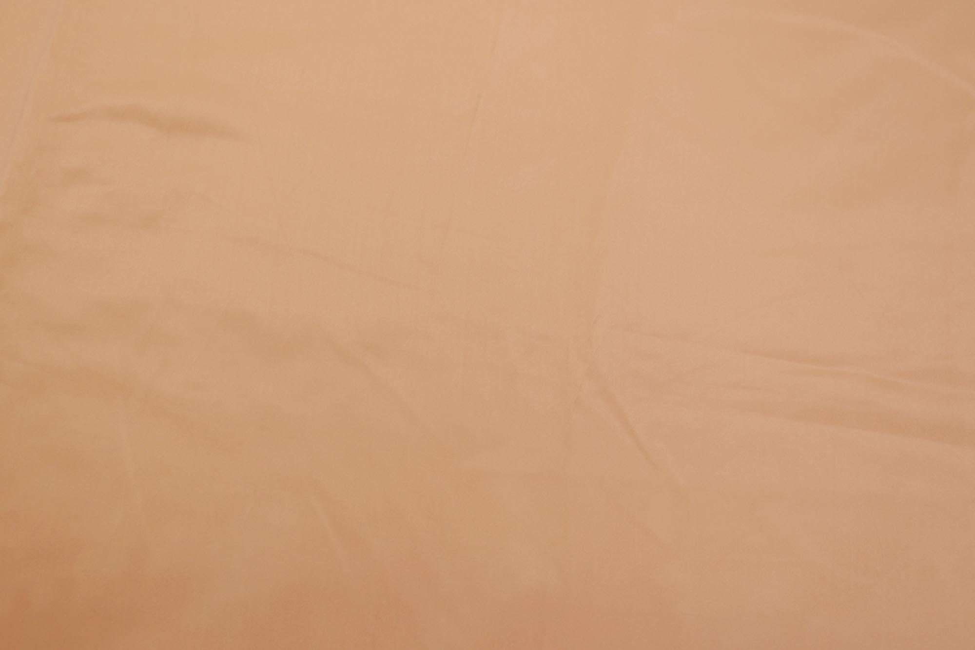 Pastel orange coloured habutai silk fabric