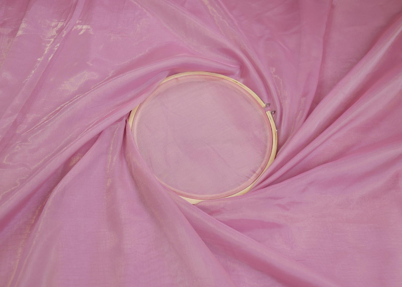 Purple pink coloured Soft tissue tissue fabric with silver shimmer