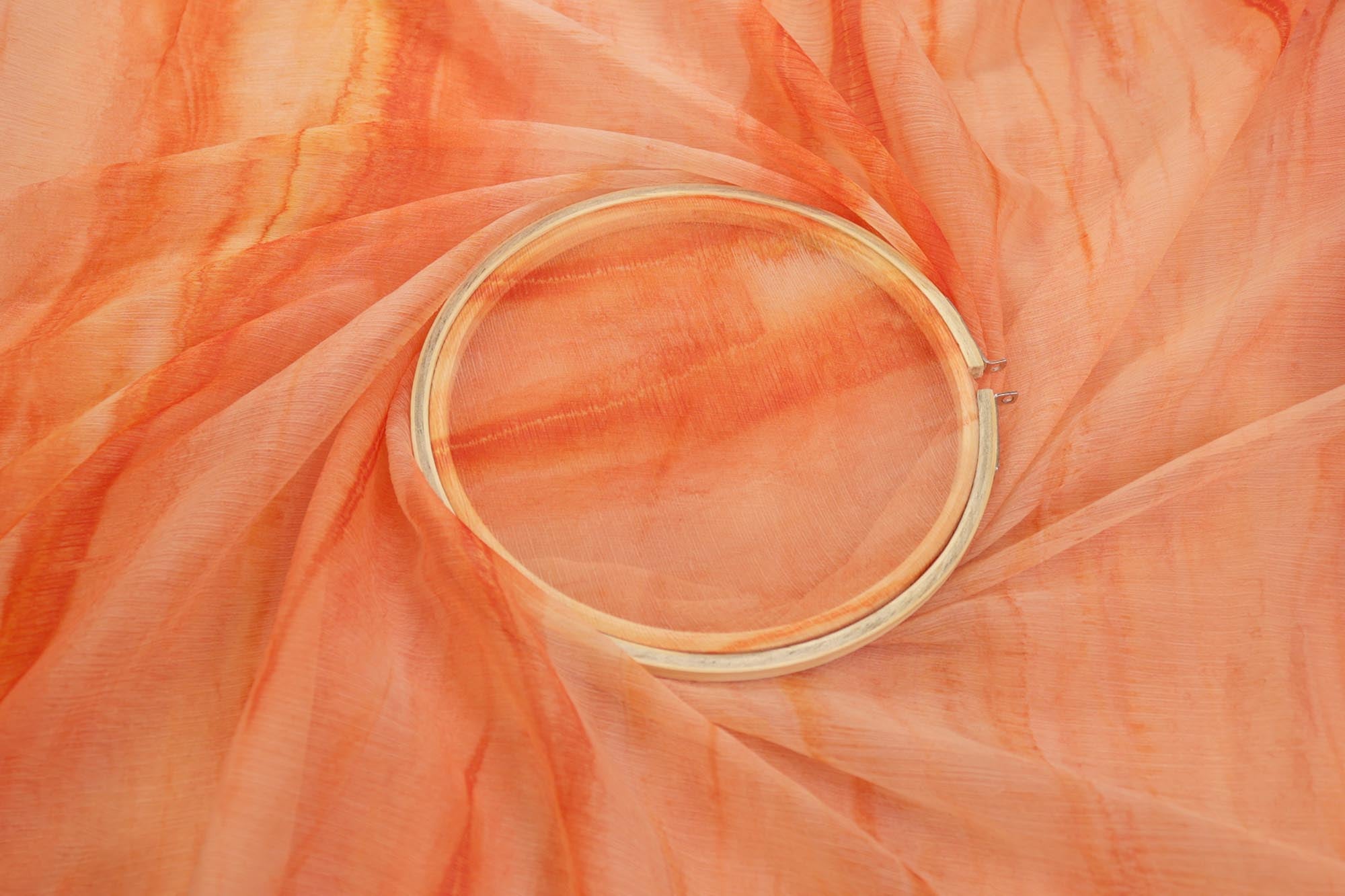 Light orange Coloured textured chiffon fabric