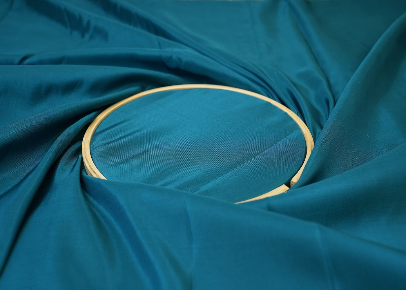 Teal blue coloured upada silk fabric - Paras Gallery Fabrics