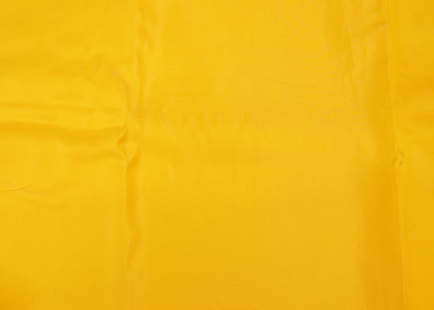 Bright yellow coloured upada silk fabric