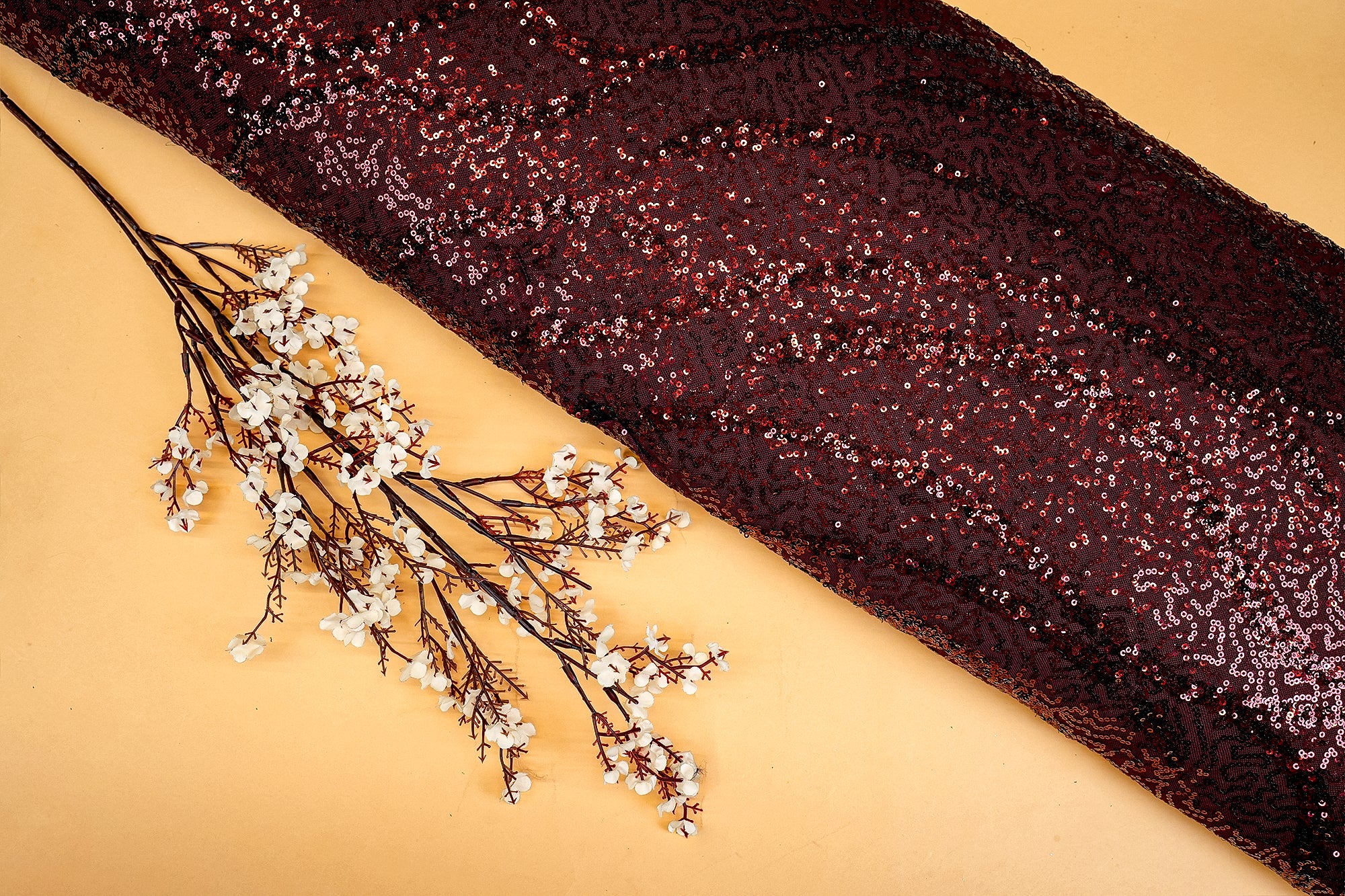 Maroon abstract pattern lycra net with all over sequins - Paras Gallery Fabrics