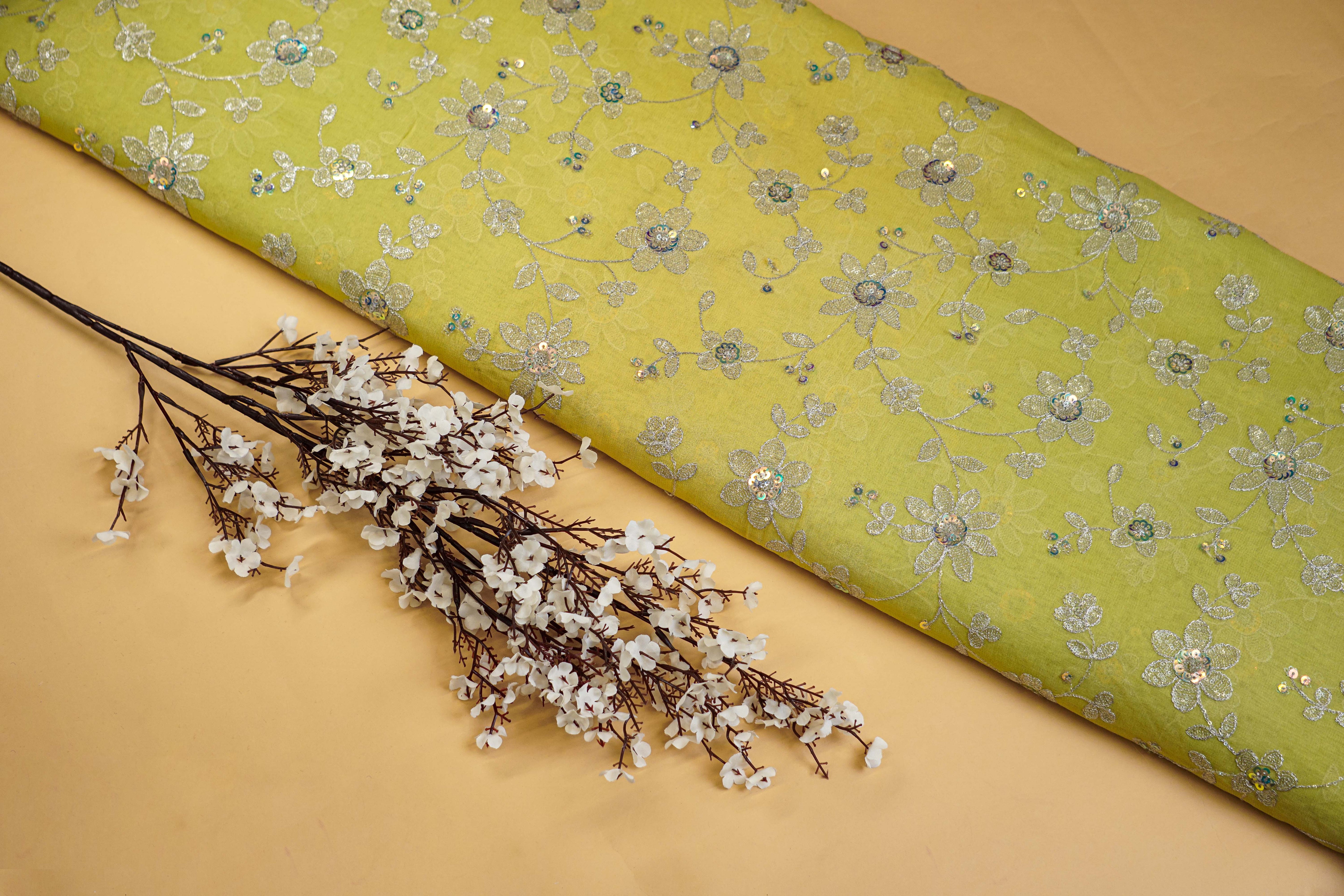 Zari with sequins creating floral pattern all over on soft georgette fabric