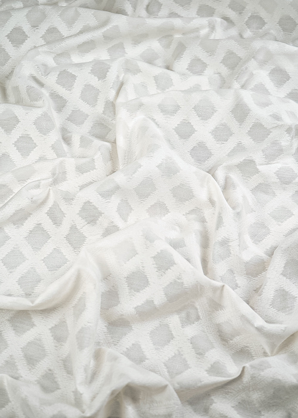 White Dyeable Cotton Fabric With All Over Self Work 10016