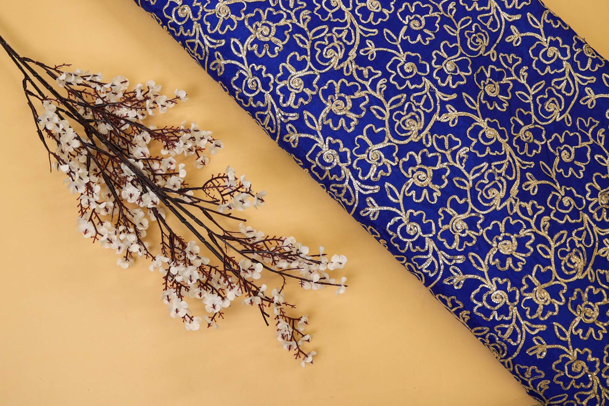 Royal Blue georgette fabric with gotta patti work creating floral allover pattern