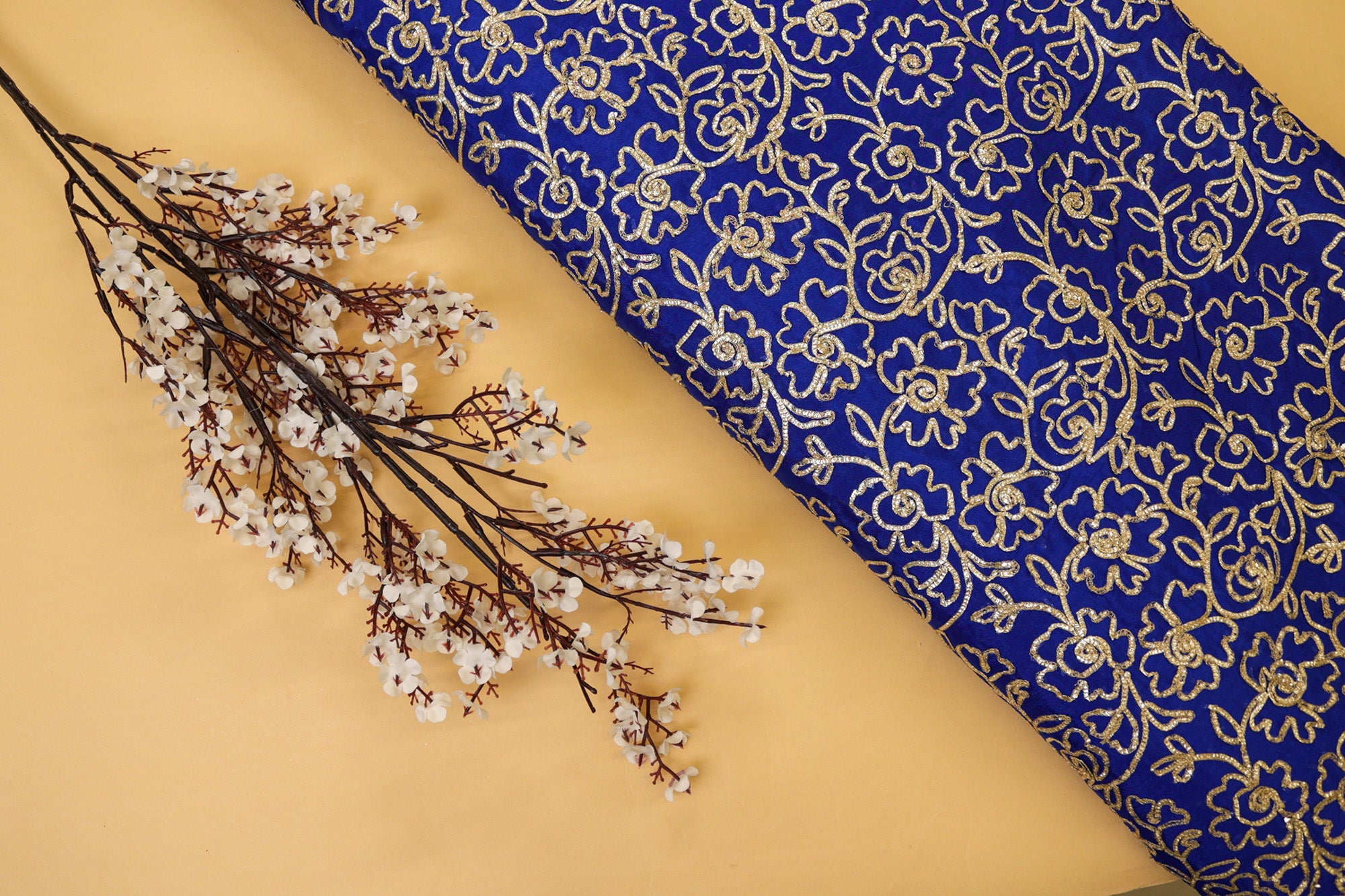 Royal Blue georgette fabric with gotta patti work creating floral allover pattern