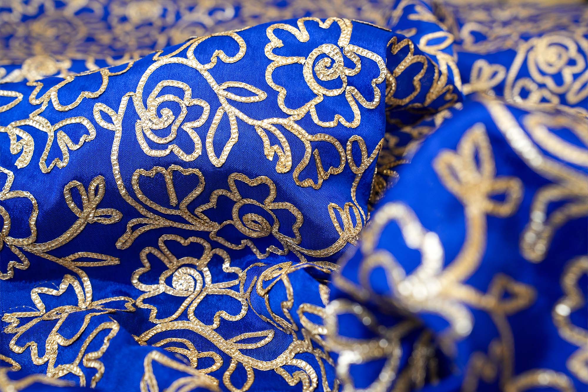 Royal Blue georgette fabric with gotta patti work creating floral allover pattern