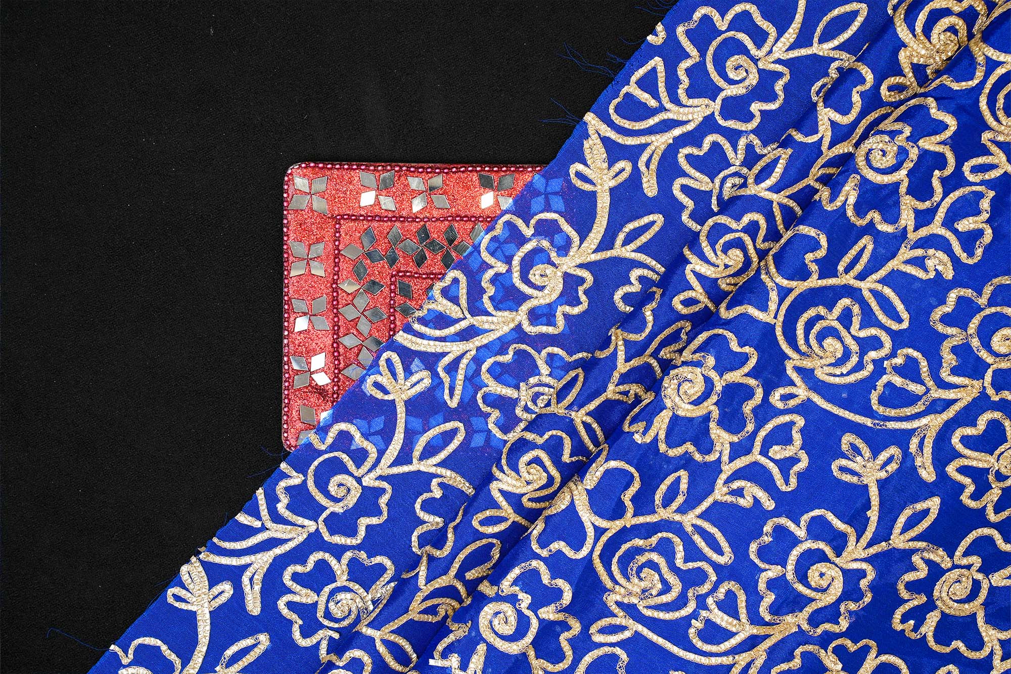 Royal Blue georgette fabric with gotta patti work creating floral allover pattern