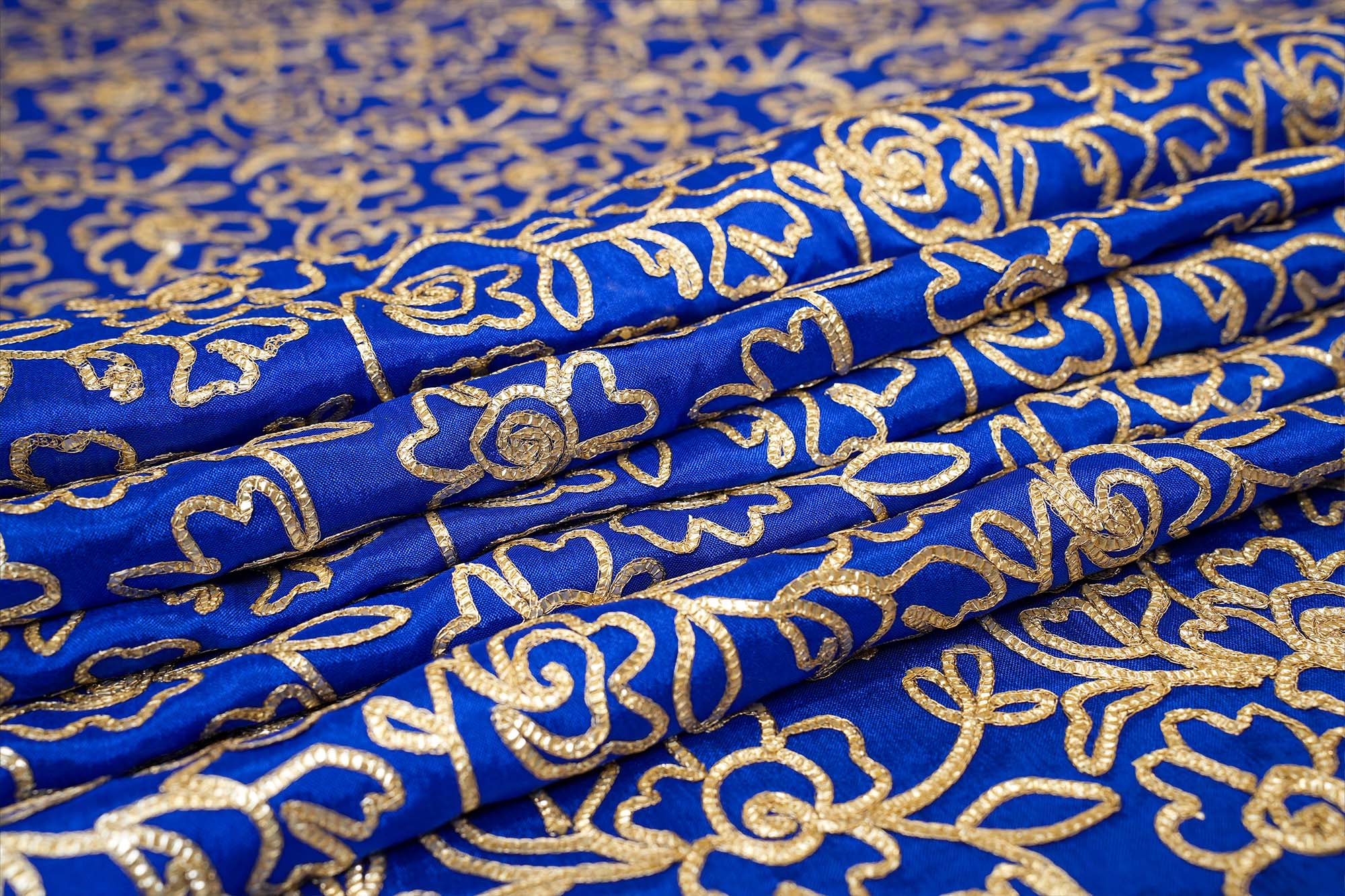 Royal Blue georgette fabric with gotta patti work creating floral allover pattern