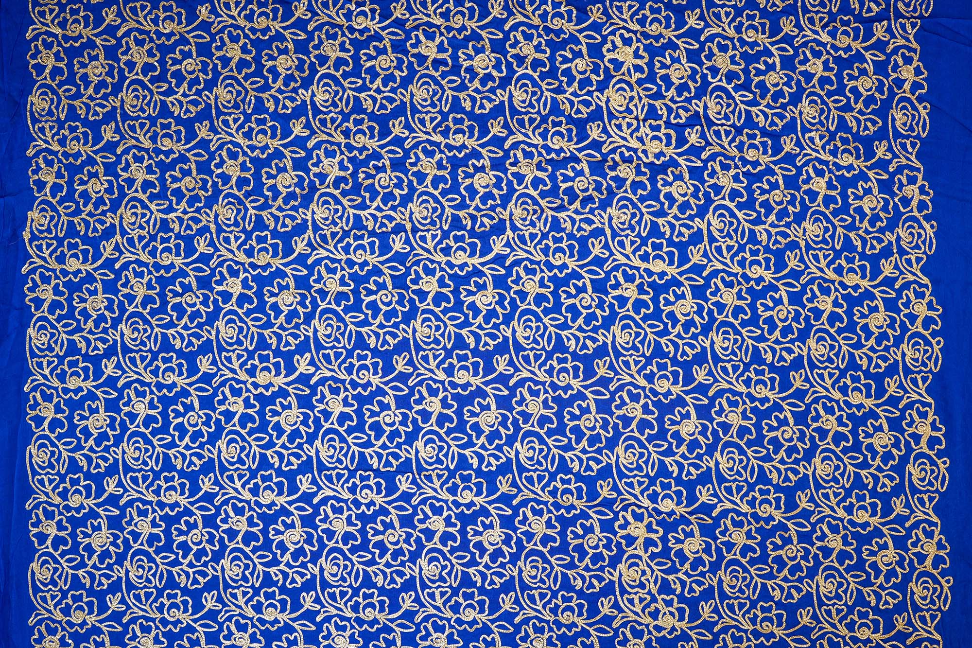 Royal Blue georgette fabric with gotta patti work creating floral allover pattern