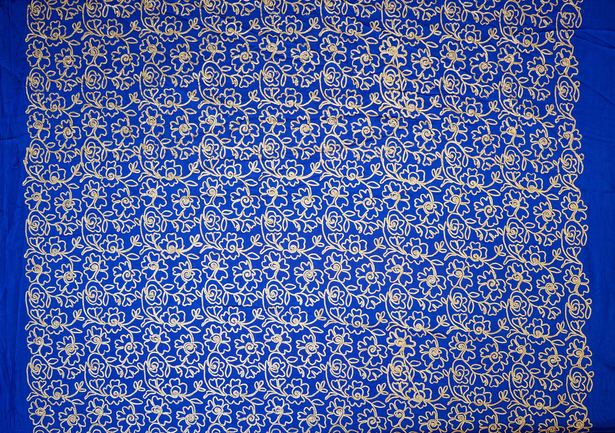 Royal Blue georgette fabric with gotta patti work creating floral allover pattern