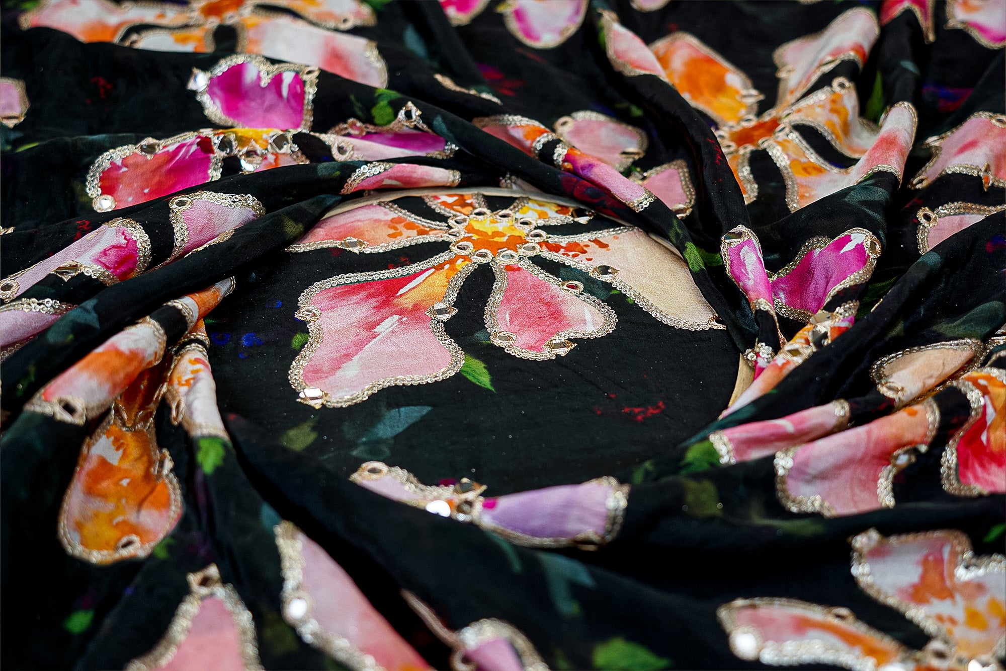 Black floral crepe fabric with zari, faux mirror, and sequin embellishments for elegant designs - Paras Gallery Fabrics