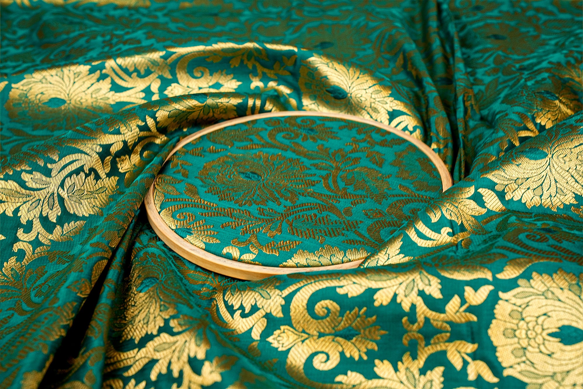 Green Banarasi brocade fabric with golden traditional print design- Paras Gallery Fabrics