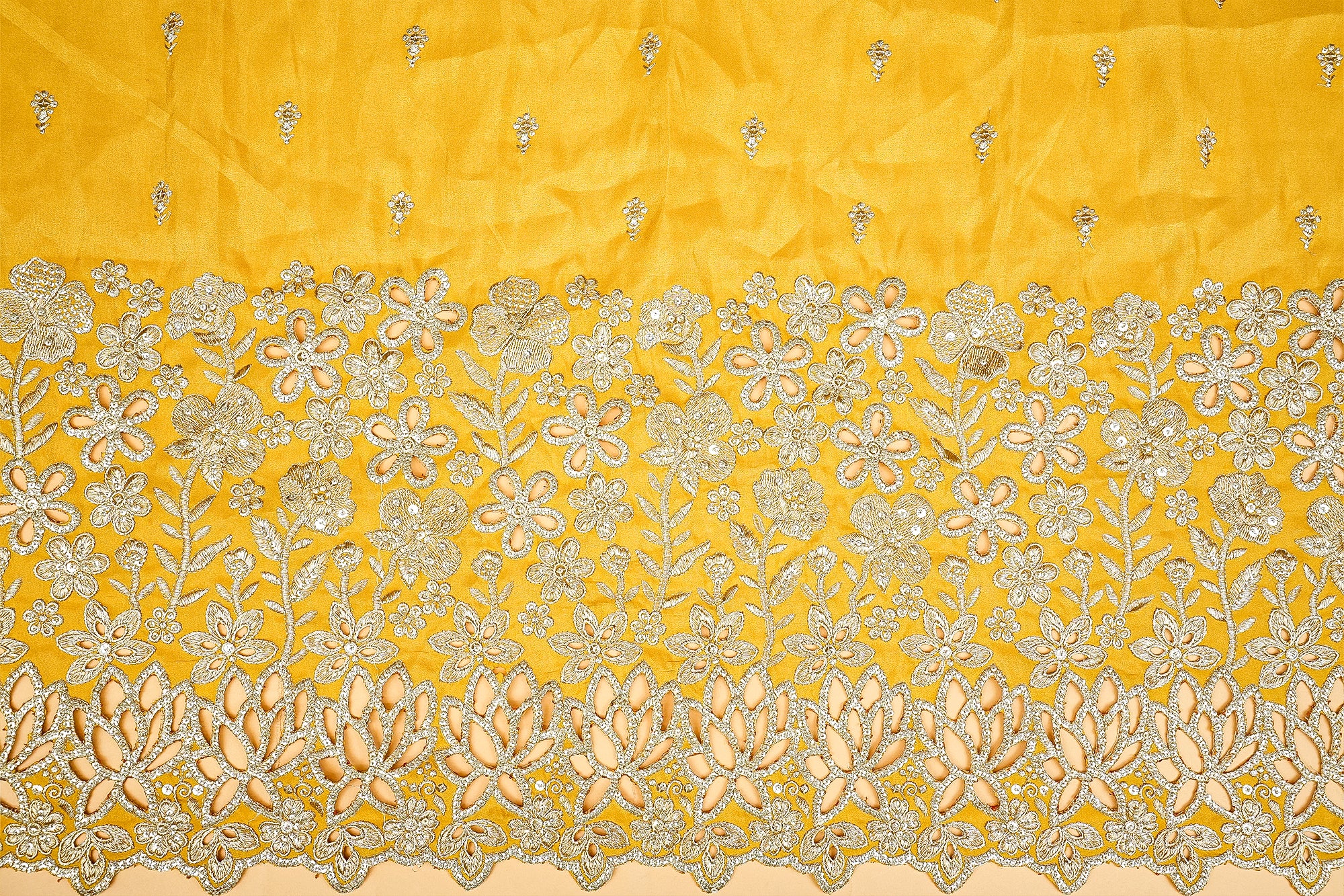 Elegant yellow silk saree featuring detailed embroidery, representing a blend of tradition 