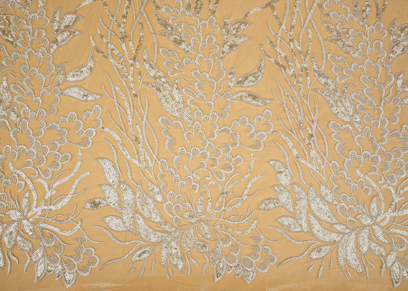 Luxurious fabric featuring an intricate gold and silver floral pattern