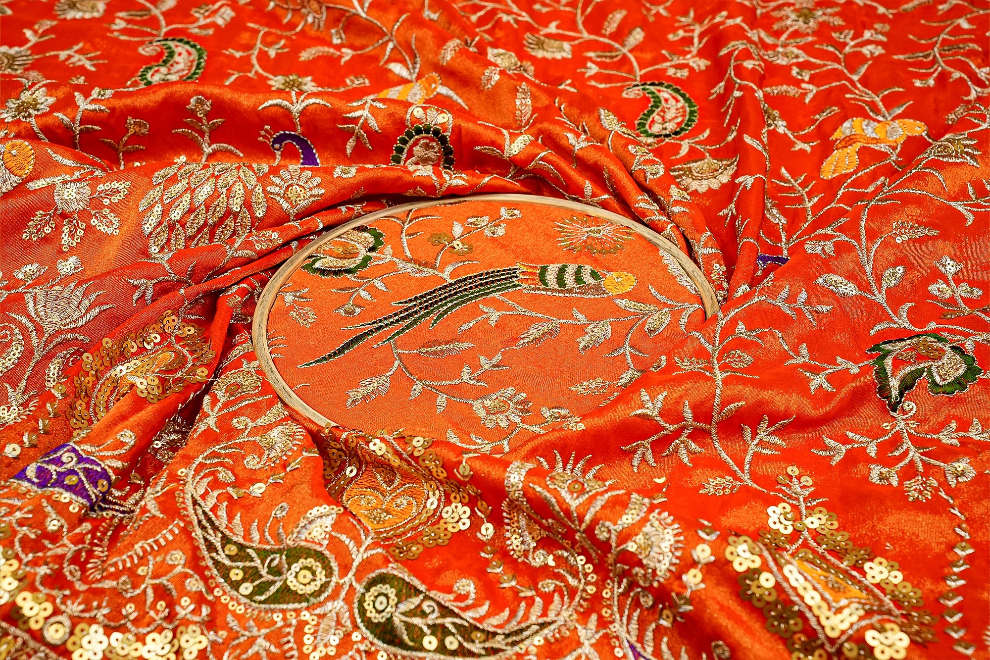 Orange Glow Tissue Fabric with All-Over Zari, Sequins, and Multicolor Threadwork Embellishments