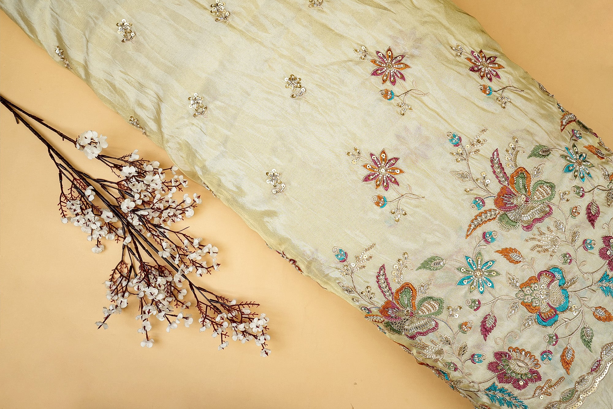 Golden Tissue Fabric with Heavy Floral Border of Sequins, Beads, Kutdana, and Threadwork