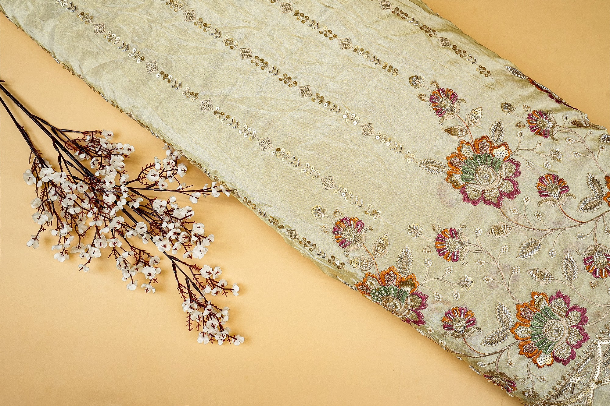 Golden Tissue Fabric with Heavy Floral Border of Sequins, Beads, Kutdana, and Threadwork