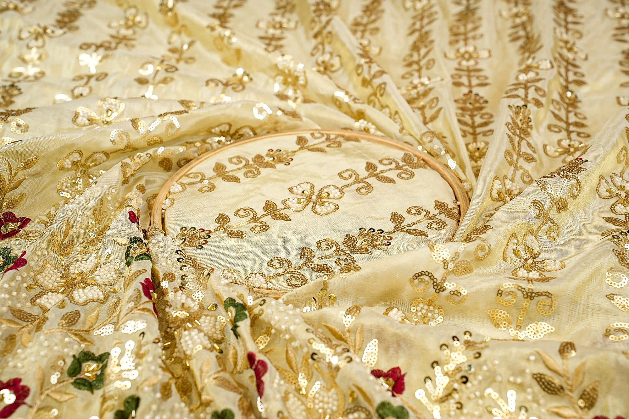 Golden Tissue Fabric with Heavy Floral Border of Sequins, Beads, Kutdana, and Threadwork